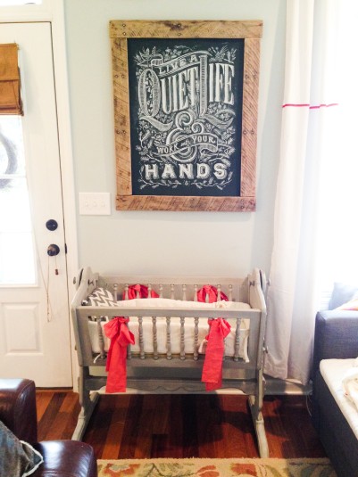 Dana Tanamachi print (frame made by my dad) hangs above the cradle (made by my Pop), in the living room near my desk.